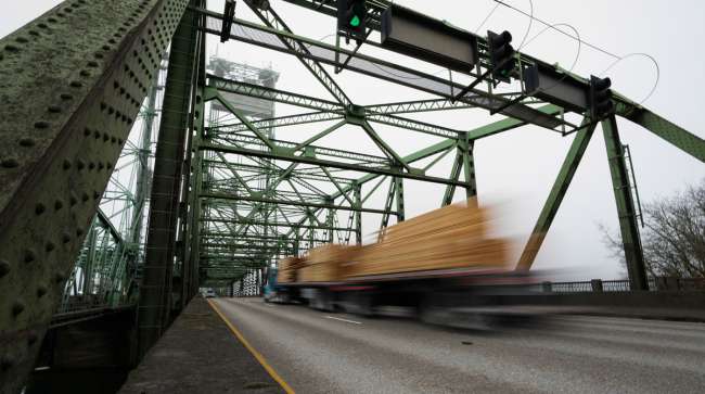 Blurred truck drives over steel bridge Blurred truck drives over steel bridge